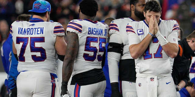 Buffalo Bills quarterback Josh Allen (17) pauses as teammate Damar Hamlin is attended by medical staff, Monday, Jan. 2, 2023, in Cincinnati.
