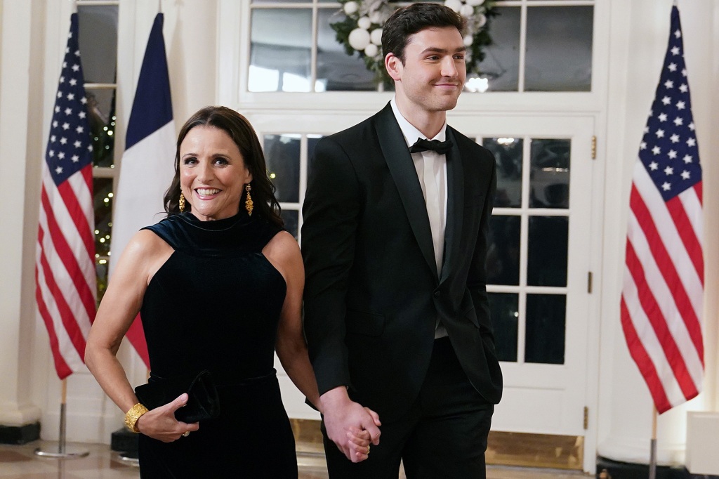 Julia Louis-Dreyfus and her son Charlie Hall arrive for the White House state dinner for French President Emmanuel Macron at the White House on December 1, 2022