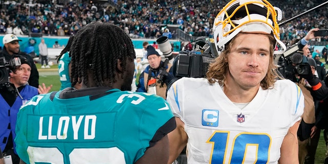 Los Angeles Chargers quarterback Justin Herbert (10) walks off the field after a wild-card playoff loss against the Jacksonville Jaguars, Saturday, Jan. 14, 2023, in Jacksonville, Florida.