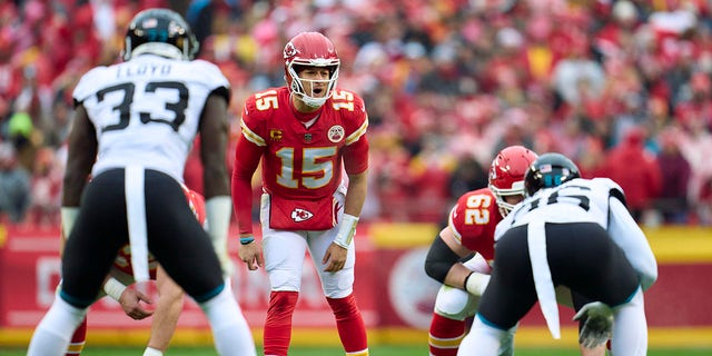 Patrick Mahomes (15) of the Kansas City Chiefs calls a play at the line of scrimmage against the Jacksonville Jaguars during the first half at GEHA Field at Arrowhead Stadium Jan. 21, 2023, in Kansas City, Mo.