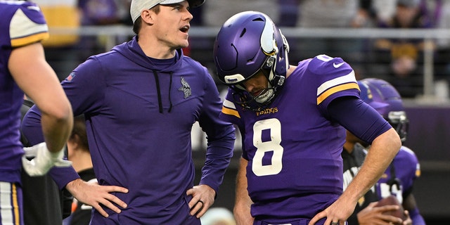 Kirk Cousins and head coach Kevin O'Connell of the Minnesota Vikings talk before the New York Giants game at U.S. Bank Stadium on Jan. 15, 2023 in Minneapolis.