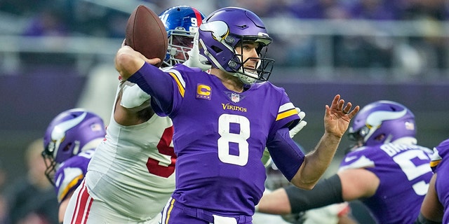 Minnesota Vikings' Kirk Cousins thorws during the first half of an NFL wild card football game against the New York Giants Sunday, Jan. 15, 2023, in Minneapolis. 