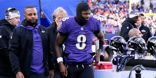 Baltimore Ravens quarterback Lamar Jackson (8) leaves the injury tent and heads toward the locker room during the first half of a game against the Denver Broncos Dec. 4, 2022, in Baltimore. 