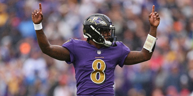 Quarterback Lamar Jackson #8 of the Baltimore Ravens celebrates after teammate J.K. Dobbins #27 scored a touchdown in the first quarter against the Buffalo Bills at M&amp;T Bank Stadium on October 02, 2022 in Baltimore, Maryland.