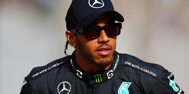 Lewis Hamilton of Great Britain and Mercedes looks on ahead of the F1 2022 End of Year photo prior to the F1 Grand Prix of Abu Dhabi at Yas Marina Circuit on Nov. 20, 2022 in Abu Dhabi, United Arab Emirates.