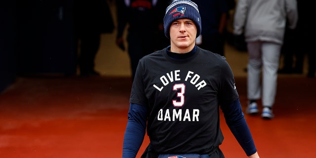 New England Patriots quarterback Mac Jones wears a shirt in support of Buffalo Bills safety Damar Hamlin during practice, Sunday, Jan. 8, 2023, in Orchard Park, N.Y.