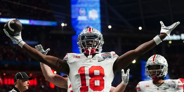 Ohio State wide receiver Marvin Harrison Jr. celebrates hos touchdown catch against Georgia, Saturday, Dec. 31, 2022, in Atlanta.