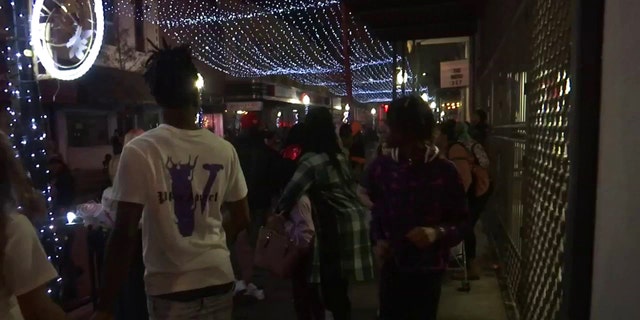 Crowds of people celebrating New Year's Eve in downtown Mobile begin to thin out after a deadly shooting Saturday night.