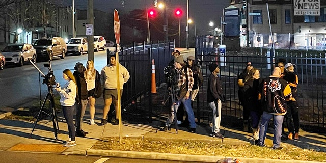 Press and fans gather outside the hospital as they wait for news about Buffalo Bills safety Damar Hamlin after the 24-year-old player collapsed after a tackle. 