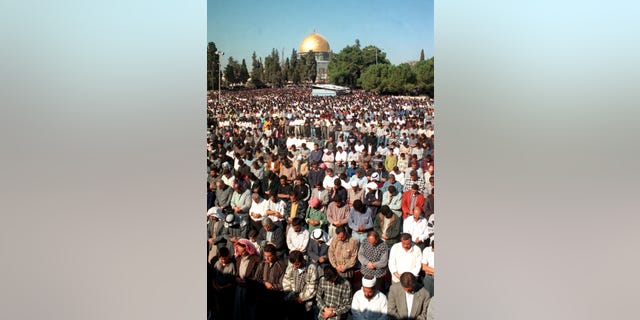 Muslim worshipers fill the grounds outside the Al-Aqsa mosque on the last Friday of Ramadan, Dec. 31. About 400,000 Muslims packed Islam's thrid holiest shrine during this holy month of fasting and prayer.