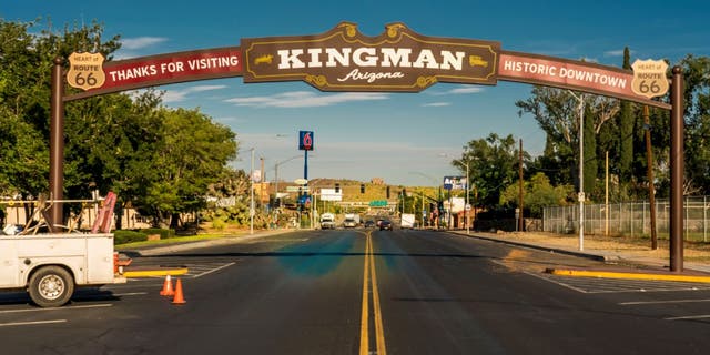 Historic Kingman, Arizona road sign over entrance of town. 