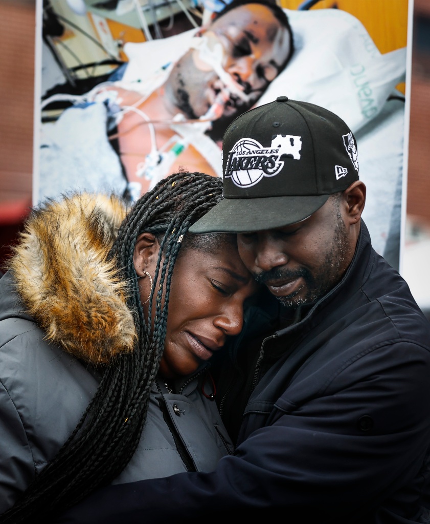 Kenyana Dixon is comforted during a rally for her brother Tyre Nichols at the National Civil Rights Museum on Jan. 16, 2023.