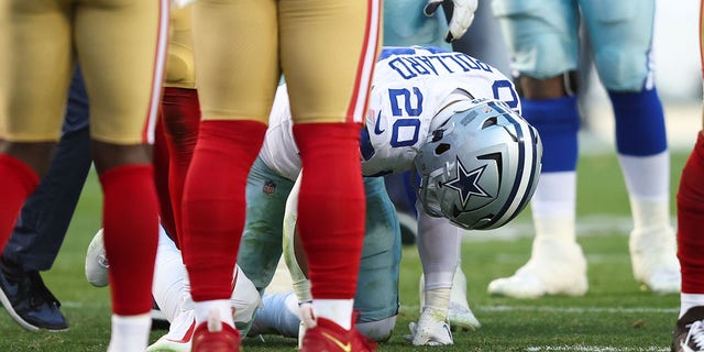 Tony Pollard of the Dallas Cowboys reacts after suffering an injury against the San Francisco 49ers at Levi's Stadium on January 22, 2023, in Santa Clara, California.