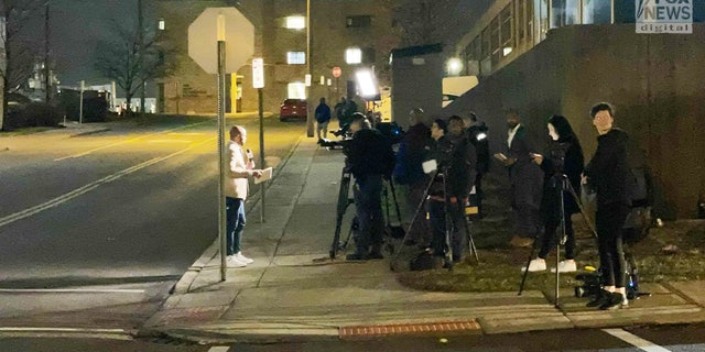 Members of the press wait outside the University of Cincinnati Medical Center as they wait for an update on injured player Damar Hamlin.