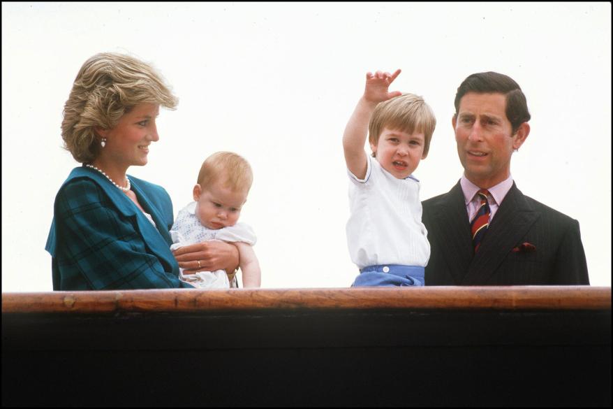 Princess Diana holds Harry, whilst looking at Prince William held by his father, then Prince Charles on May 5, 1985 in Venice, Italy.
