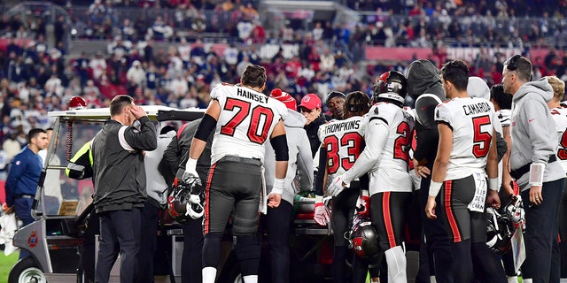 Russell Gage #17 of the Tampa Bay Buccaneers is carted off the field after suffering an injury against the Dallas Cowboys during the fourth quarter in the NFC Wild Card playoff game at Raymond James Stadium on January 16, 2023 in Tampa, Florida.