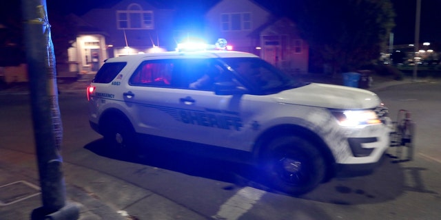 A Sonoma County Sheriff's Office vehicle drives through a neighborhood along Mark West Springs Road in Santa Rosa, Calif., on Oct. 26, 2019. 