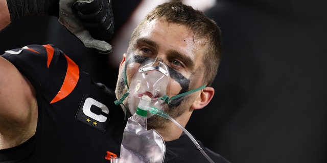 Bengals defensive end Sam Hubbard uses oxygen after his 98-yard touchdown run on Jan. 15, 2023, in Cincinnati.