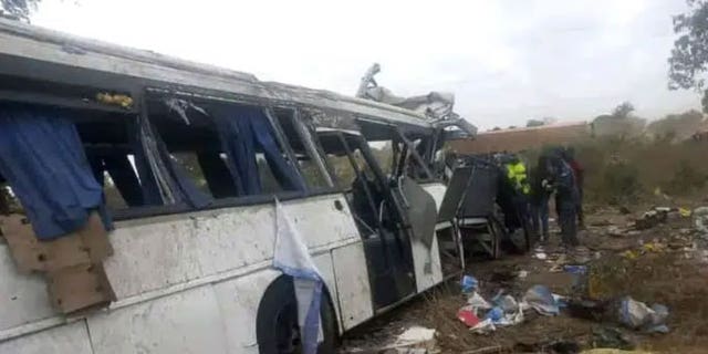 A damaged bus is pictured at the site of a collision between two buses on a road in Gniby, Senegal, Sunday Jan. 8, 2023. At least 40 people were killed and dozens injured in this bus crash in central Senegal, the country's president Macky Sall said Sunday. 