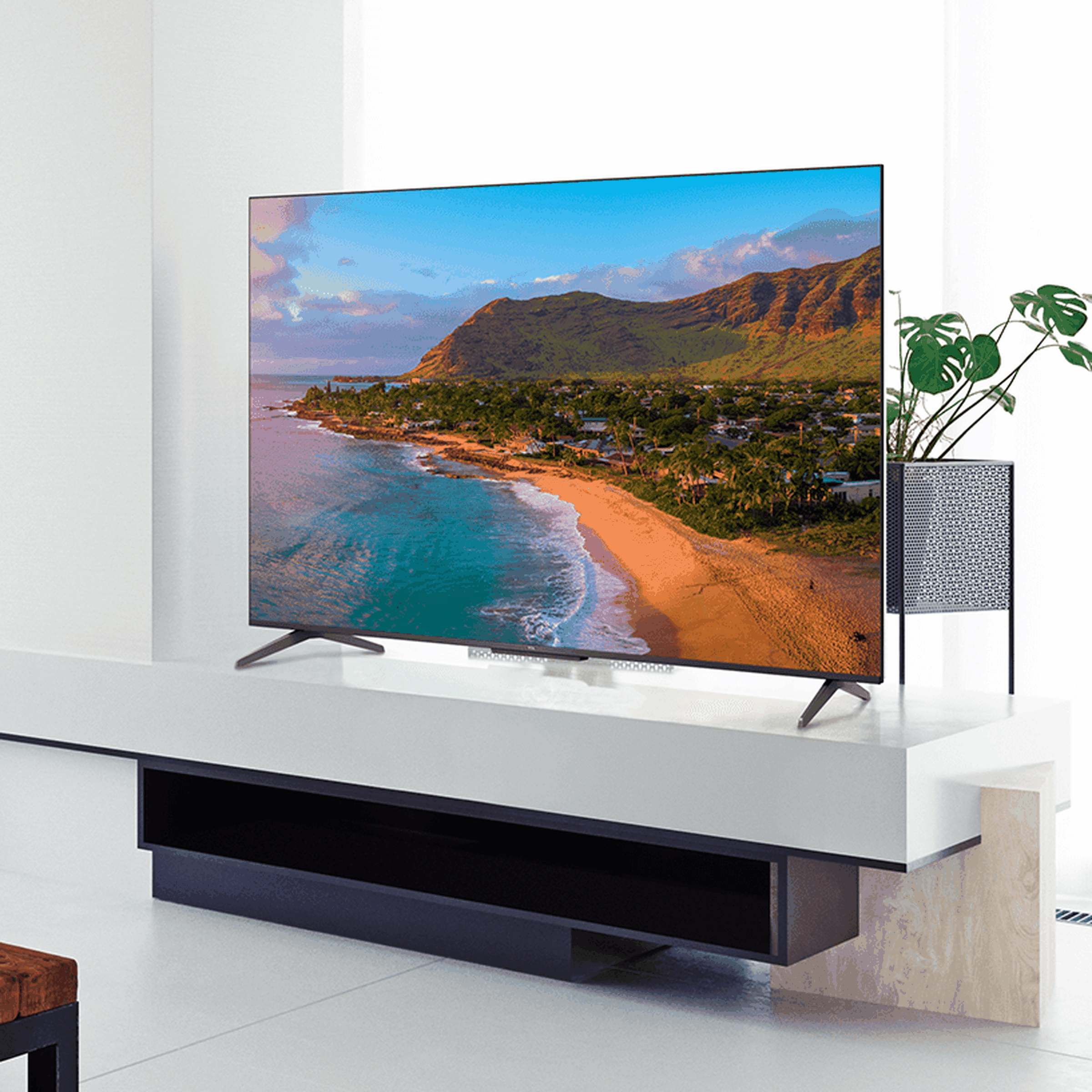 A lifestyle shot of the 65-inch TCL 5-Series QLED TV in a living room.