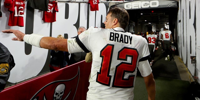 Tom Brady #12 of the Tampa Bay Buccaneers walks off the field after losing to the Dallas Cowboys 31-14 in the NFC Wild Card playoff game at Raymond James Stadium on January 16, 2023 in Tampa, Florida.