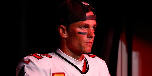 Tom Brady of the Buccaneers walks through the tunnel at Raymond James Stadium before the wild-card game against the Dallas Cowboys on Jan. 16, 2023, in Tampa, Florida.