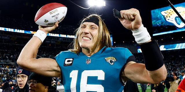 Trevor Lawrence of the Jacksonville Jaguars celebrates after beating the Los Angeles Chargers in an NFL wild-card playoff football game at TIAA Bank Field Jan. 14, 2023, in Jacksonville, Fla.