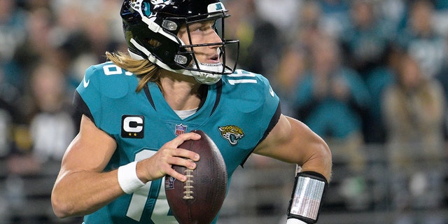 Jaguars quarterback Trevor Lawrence scrambles against the Tennessee Titans, Saturday, Jan. 7, 2023, in Jacksonville.