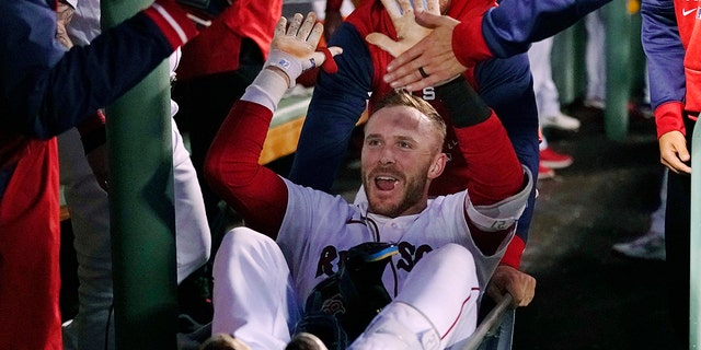 Boston Red Sox's Trevor Story is congratulated after his second two-run home run of the night, during the third inning of the team's baseball game against the Seattle Mariners at Fenway Park, Thursday, May 19, 2022, in Boston.