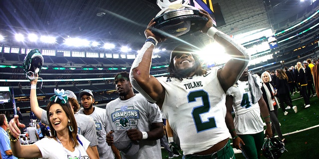 Dorian Williams #2 of the Tulane Green Wave celebrates following the teams win over USC Trojans in the Goodyear Cotton Bowl Classic on January 2, 2023 at AT&amp;T Stadium in Arlington, Texas.