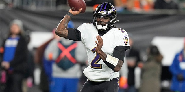 Baltimore Ravens quarterback Tyler Huntley throws in the first half of an NFL wild-card playoff football game against the Cincinnati Bengals in Cincinnati, Sunday, Jan. 15, 2023. 