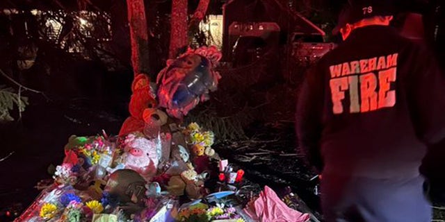 Chief John Kelley of the Wareham Fire Department attends a candlelight vigil for Cora Clancy, 5, and Dawson Clancy, 3, as the community sends prayers and support to the Clancy family on Jan. 26, 2023.