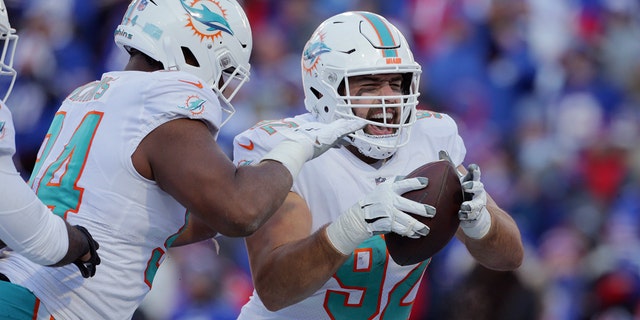 Miami Dolphins defensive tackle Zach Sieler (92) celebrates after his touchdown during the second half of an NFL wild-card playoff football game against the Buffalo Bills, Sunday, Jan. 15, 2023, in Orchard Park, New York.