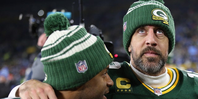 Green Bay Packers quarterback Aaron Rodgers, #12, and Green Bay Packers wide receiver Randall Cobb, #18, walk off the field after a game between the Green Bay Packers and the Detroit Lions at Lambeau Field on Jan. 8, 2023 in Green Bay, Wisconsin.