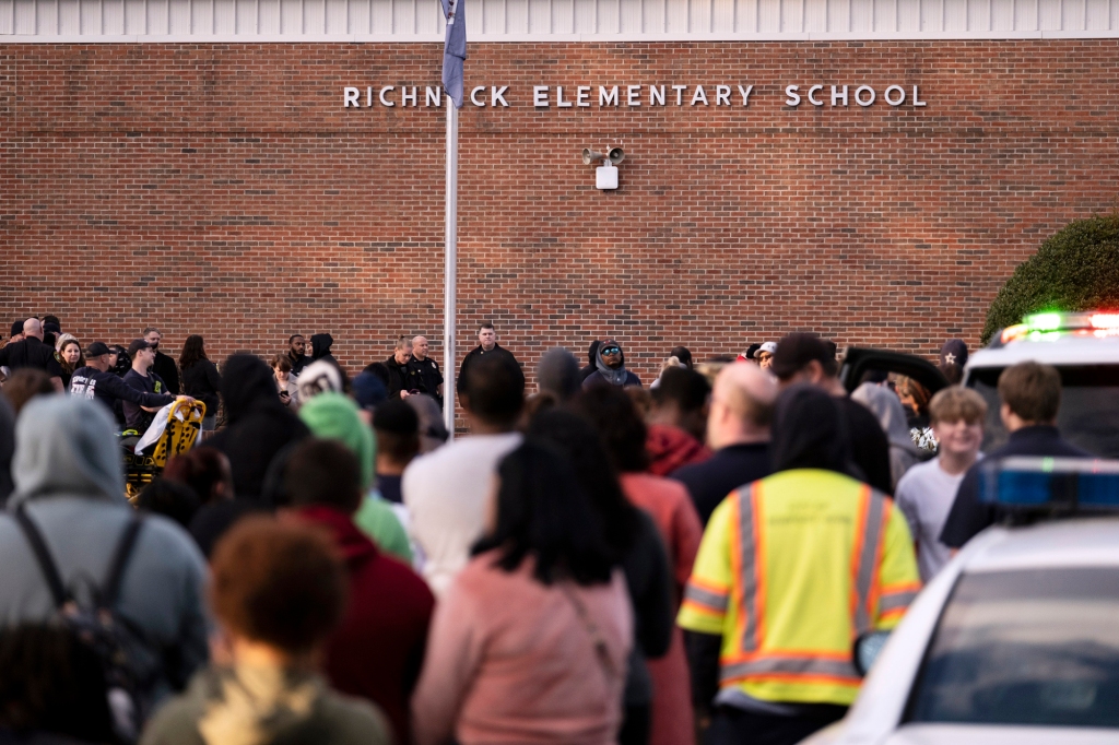 Students and police gather outside of Richneck Elementary School after the incident.