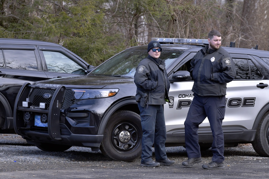 Cohasset Police guard the driveway outside the home where Ana Walshe was last seen.