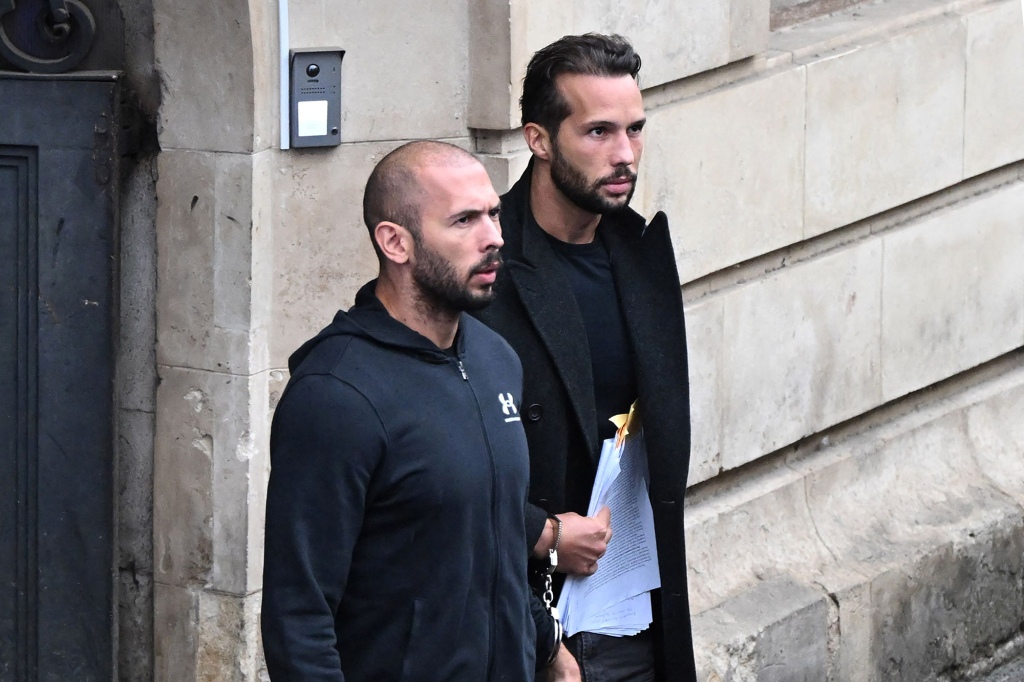 Andrew Tate and Tristan Tate exit a court in Bucharest, Romania.