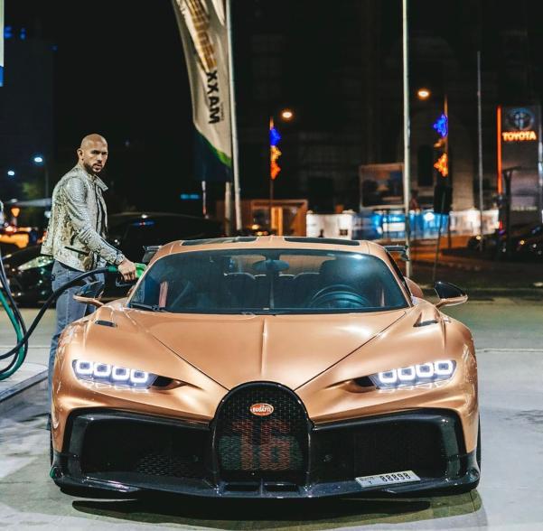 Andrew Tate filling up one of his many luxary cars.