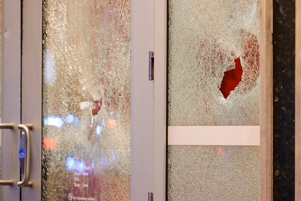 Broken glass at a Wells Fargo branch during protests in Atlanta on Saturday, Jan. 21.