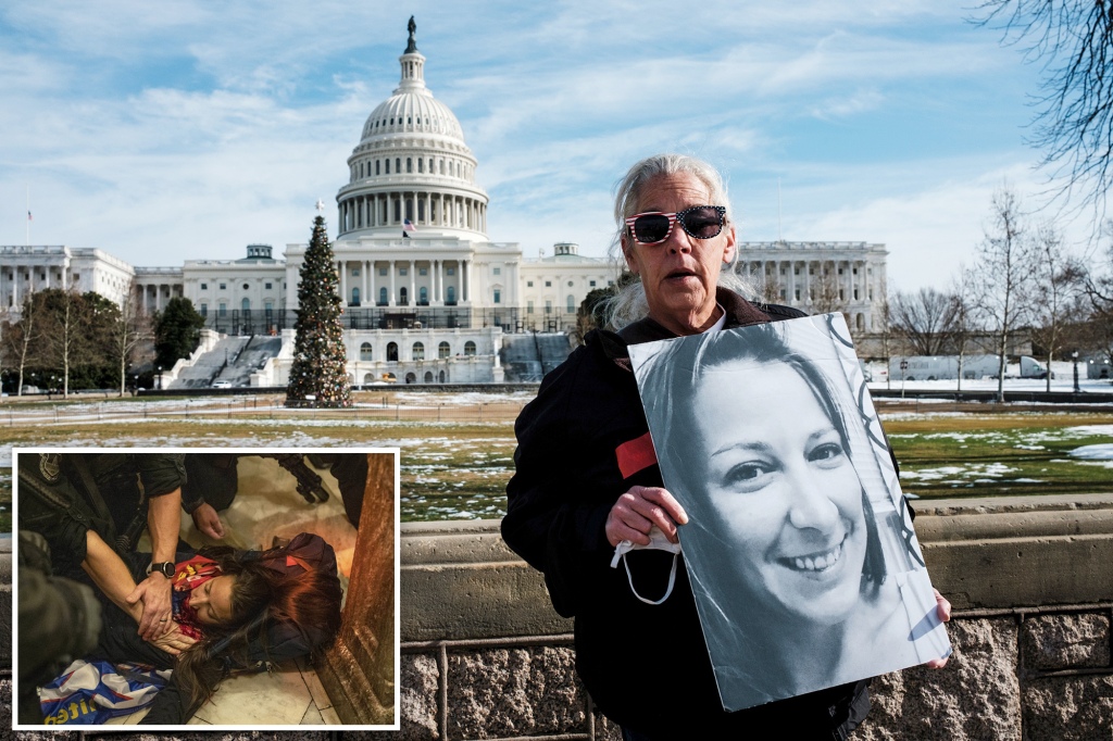Micki Witthoeft holds a poster of her daughter, who died during the Capitol riots on Jan. 6.