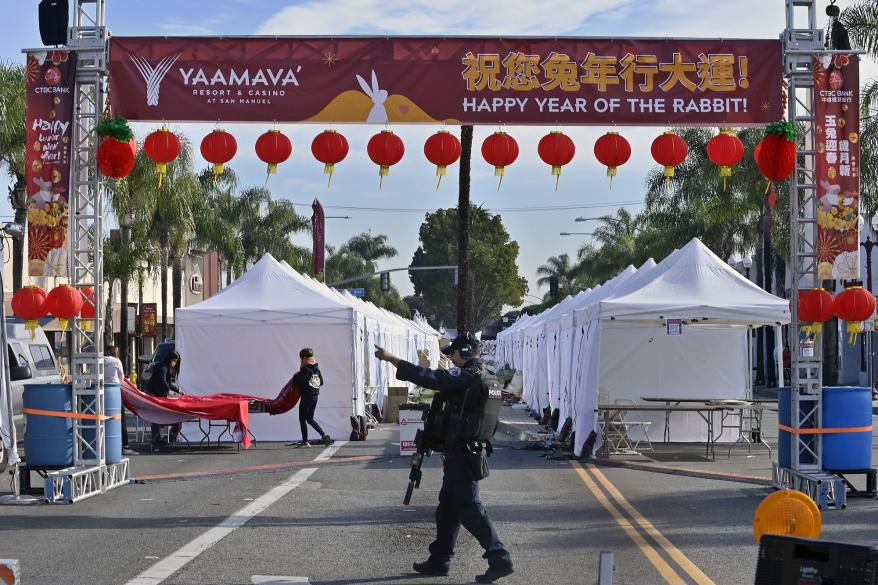 Tents set up on Monterey Park street below Lunar New Year banner