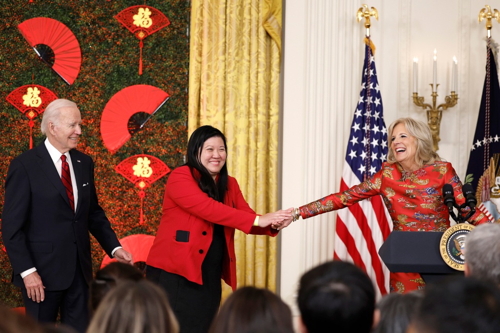 First lady Jill Biden introduces CEO of Asian Services in Action (ASIA) Elaine Tso as President Biden looks on.