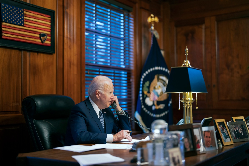 A picture of Joe Biden on the phone.