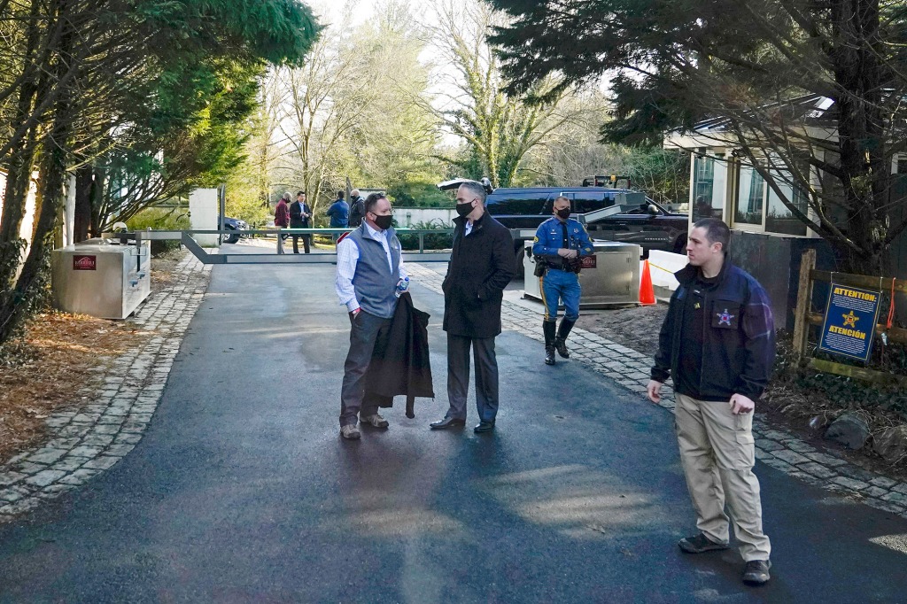 Security personnel stand at the entrance to President Joe Biden and first lady Jill Biden's home in Wilmington, Del.