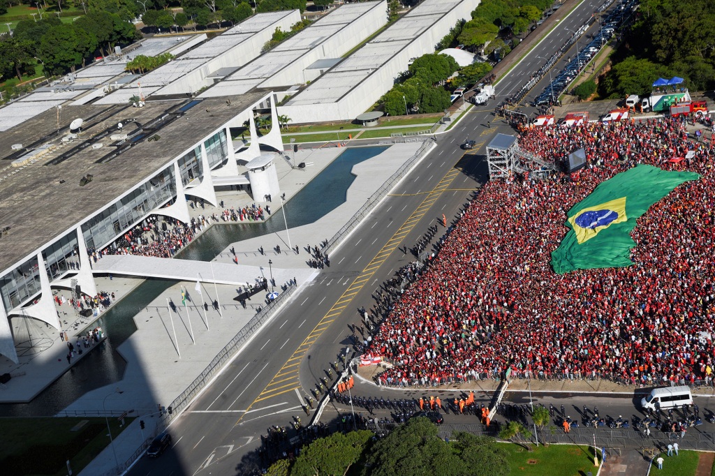 Supporters of Brazil's new President Luiz Inacio Lula da Silva gather outside the Planalto Palace in Brasilia, Brazil on Jan. 1, 2023. 