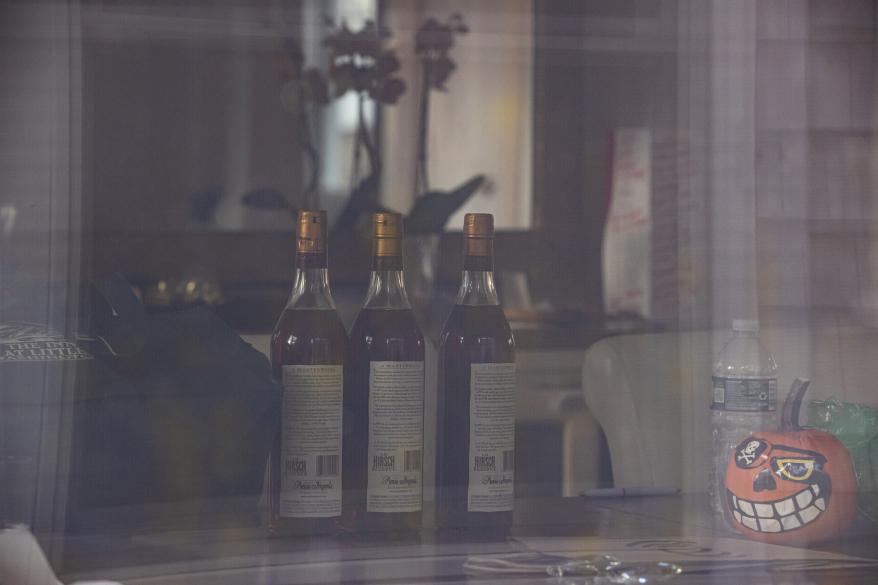 Three bottles of A.H. Hirsch Reserve Whiskey were spotted on the kitchen table inside the Walshe’s home.