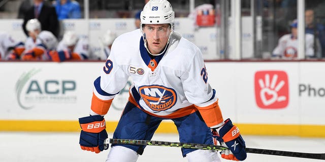 Brock Nelson of the New York Islanders gets ready during a face-off against the Arizona Coyotes at Mullett Arena Dec. 16, 2022, in Tempe, Ariz. 