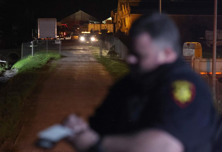 Law enforcement officials work at the scene of a shooting on Jan. 23, 2023 in Half Moon Bay, California.