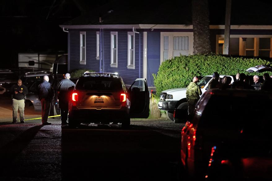 Law enforcement officials investigate a property following a mass shooting on Jan. 23, 2023 in Half Moon Bay, California.