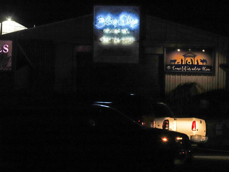 A neon sign lights up the location of the mass shooting in Half Moon Bay, California, on Jan. 23, 2023.